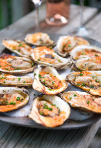 grilled oysters with roasted red pepper butter