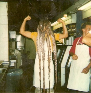Former fishmonger, Deveaux, wears a Giant Pacific Octopus on his head (circa sometime in the 1980s)